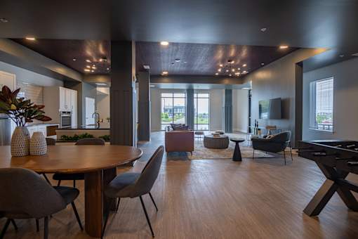A modern living room with a wooden floor and furniture.