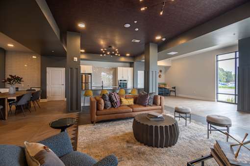 A modern living room with a grey sofa and a wooden coffee table.