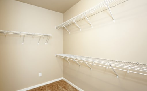 Walk-In Closets With Built-In Shelving at 7th Street Brownstones, Iowa , 50309