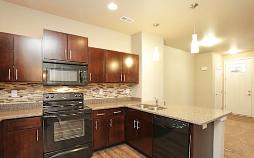Elegant And Timeless Kitchen at 7th Street Brownstones, Indigo Living, IA