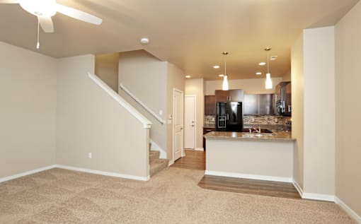 Spacious carpeted Living Room at 7th Street Brownstones, Indigo Living