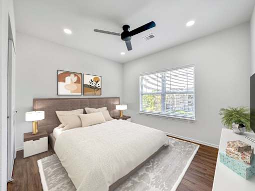 a bedroom with a bed and a ceiling fan at 92West, Iowa  