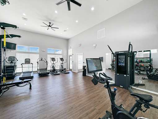 the residence apartments fitness room with weights and cardio equipment at 92West, West Des Moines, IA  