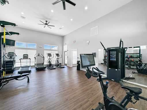 the residence apartments fitness room with exercise equipment at 92West, West Des Moines  