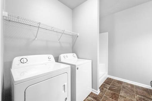 A laundry room with a washer and dryer.