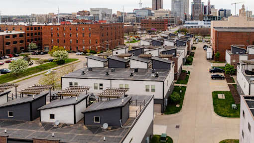 A view of a residential area with houses and buildings.