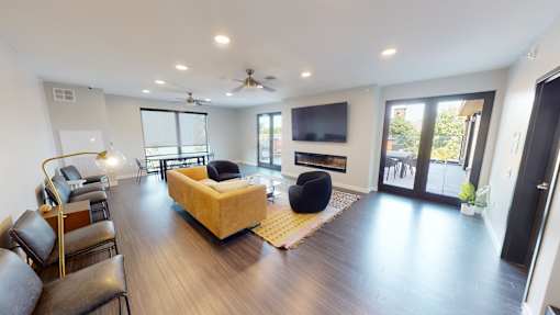 a living room with a couch and a television at Canary Lofts, Iowa, 50311