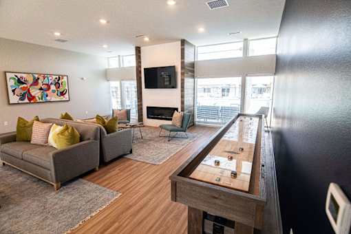 a living room with a couch and a table at Centennial Crossing, Waukee, 50263