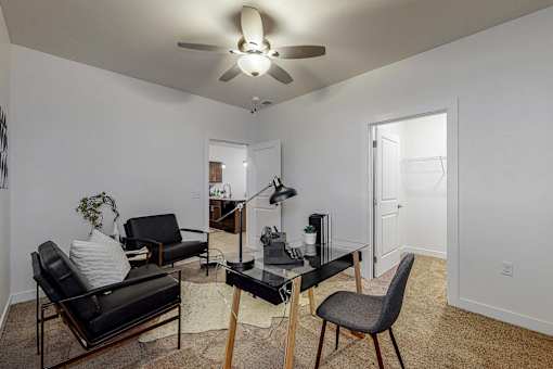 a living room with furniture and a ceiling fan at Centennial Crossing, Waukee, 50263