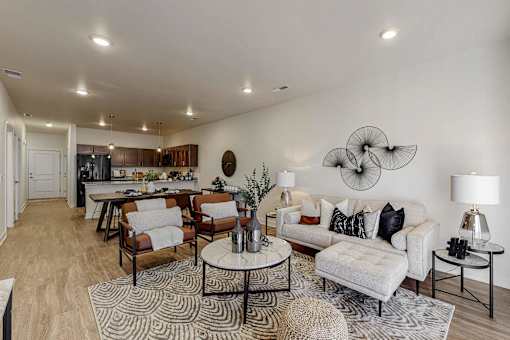 a living room with a couch and a table at Centennial Crossing, Waukee