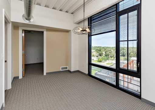 A room with a view of the outside through the window. at Eagle View Lofts, Des Moines, IA