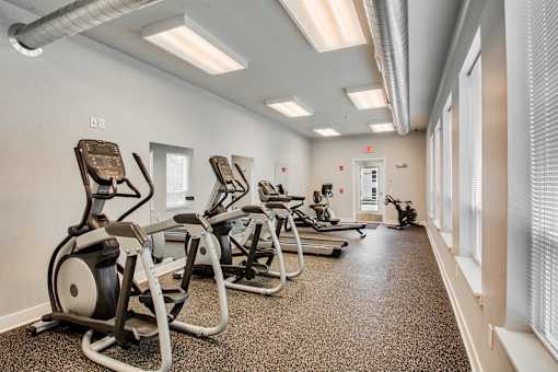 A gym with treadmills and exercise equipment.