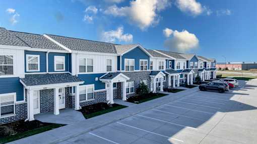 A row of houses with blue and white exteriors.