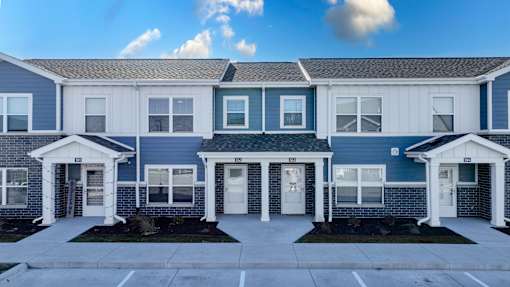 A row of houses with blue and white exteriors.