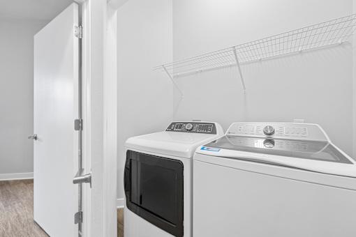 A white microwave and dishwasher in a kitchen.