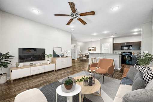 a living room with furniture and a ceiling fan at The Barclay Apartments, Altoona, IOWA