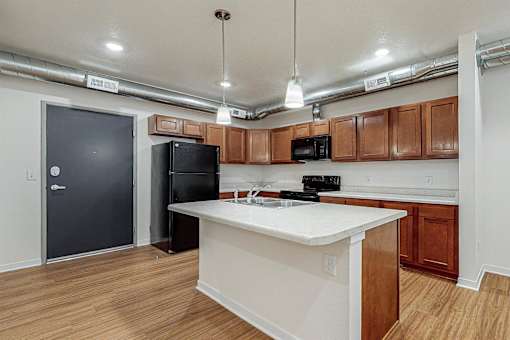 A kitchen with a white counter top at Melbourne Apartments, Des Moines, IA,  50320