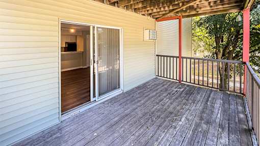 the deck of a home with a sliding glass door at Rosemont Place Apartments, Des Moines, 50320