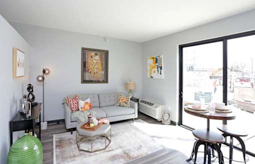 a living room with a couch and a table at Soll, Iowa   