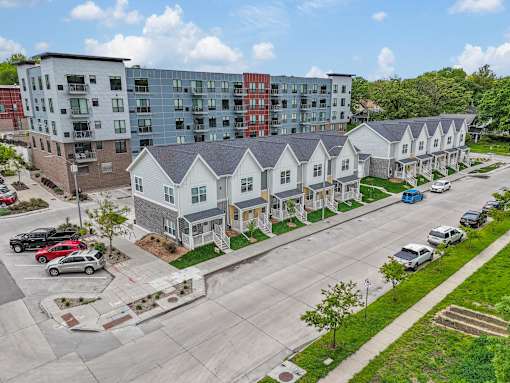 an aerial view of apartment buildings on a city street at Soll, Iowa, 50312