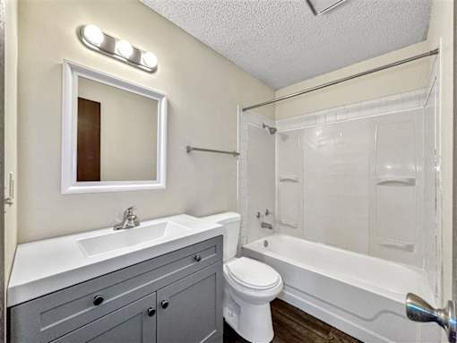 a bathroom with a sink toilet and a shower at Foxwood Apartments, Indianola Iowa  
