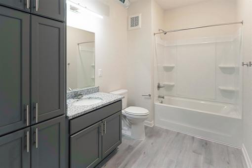 a bathroom with a sink toilet and a shower at Forge65, Pleasant Hill, 50327