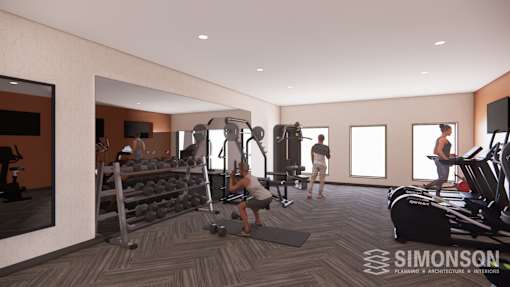 A modern gym with a variety of equipment and people working out.