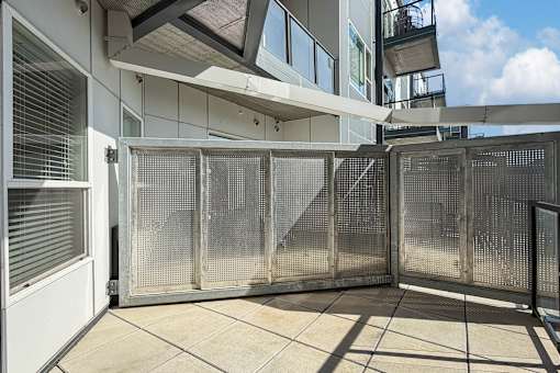 A metal grate is on the door.