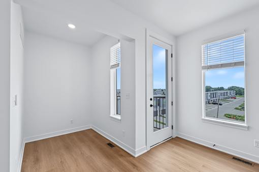 Bright room with door to private balcony at The Flats at West Glen Apartments, West Des Moines, IA 50266