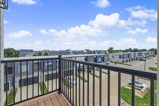 Private balcony overlooking residential community at The Flats at West Glen Apartments, West Des Moines, IA