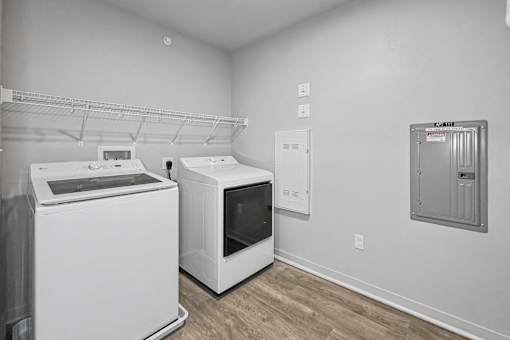 A white dishwasher and microwave in a kitchen.