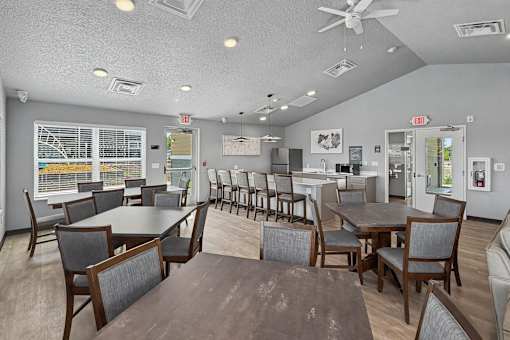 A room with a table and chairs in it.