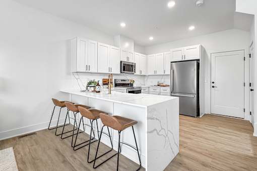 Brand new tonwhome with waterfall marble kitchen island.