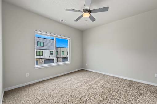 Spacious bedroom with ceiling fan