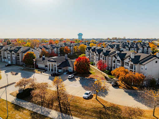 an aerial view of a neighborhood with houses and trees