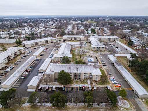 parking lot is surrounded by apartment buildings. at Bristol Ridge, Iowa