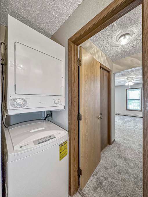 a laundry room with a washer and dryer in it at Creekstone Falls, Sioux Falls
