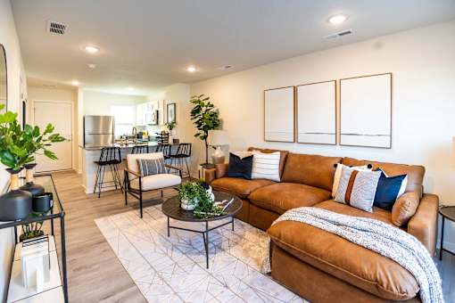 a living room with a couch and a table at Forge65, Iowa, 50327