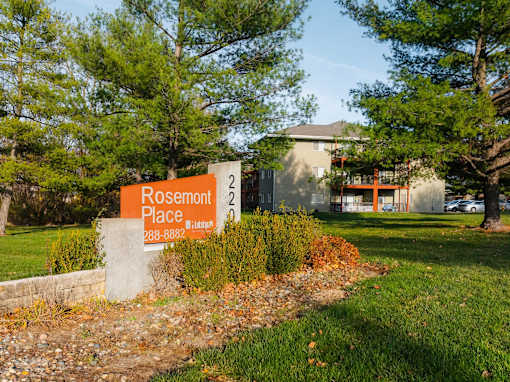 A sign for Rosemont Place is in front of a building at Rosemont Place Apartments, Iowa