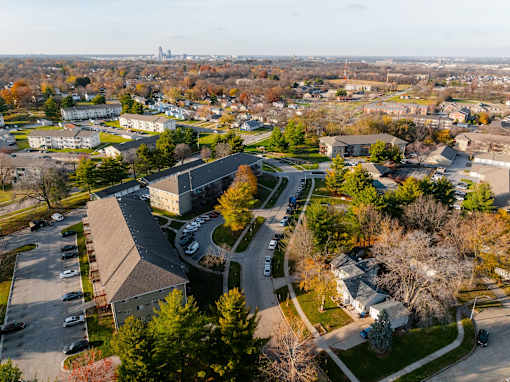 A large building with a parking lot in front of it at Rosemont Place Apartments, Des Moines, Iowa