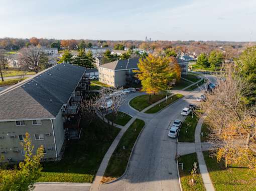 A road with cars and apartment buildings at Rosemont Place Apartments, Des Moines, IA, 50320