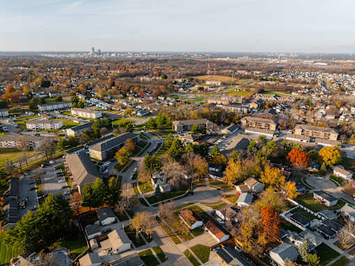 A suburban neighborhood with a mix of residential and commercial buildings. at Rosemont Place Apartments, Des Moines
