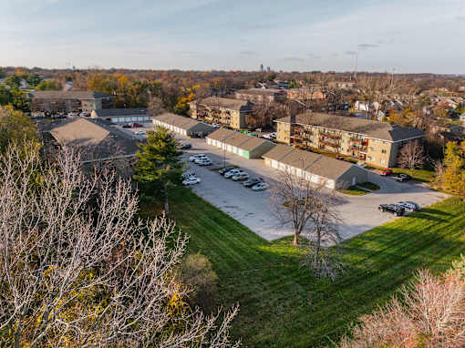 A parking lot is surrounded by apartment buildings at Rosemont Place Apartments, Des Moines, 50320