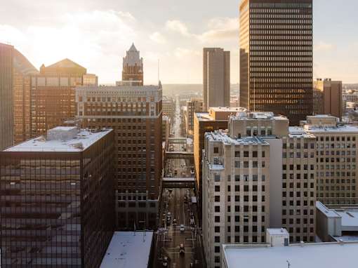 A cityscape with buildings and a clock tower.
