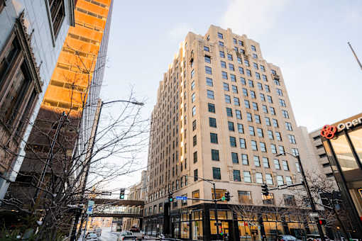 A tall building with a sign that says "Open" on the front.