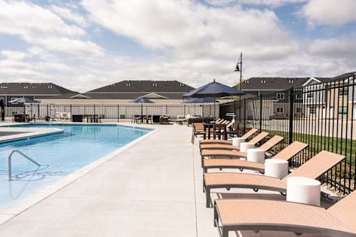 A pool with a fence and a flag on top.