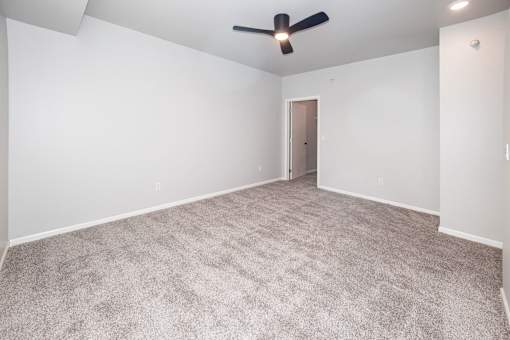 Large empty room at Meadowlark Place Apartments, Grimes, IA
