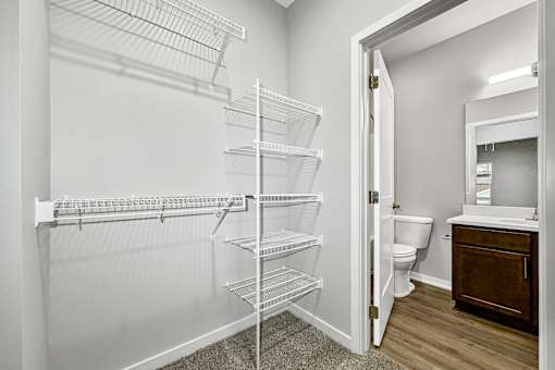 the closet in a bathroom with a shower and a toilet at Converge NW, Waukee  