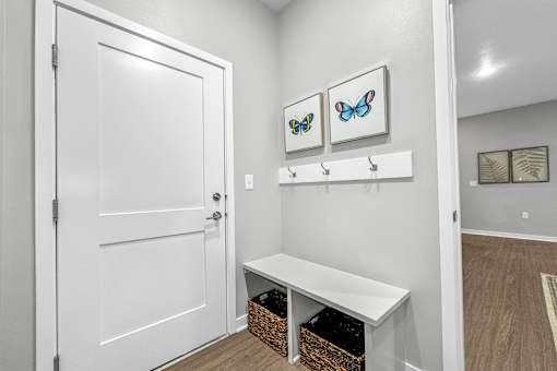 a white closet with a white door and a white bench at Converge NW, Iowa, 50263