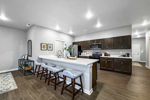 a kitchen with a large counter top in a house at Converge NW, Waukee  